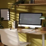 Desk Setup Ideas That Boost Productivity Minimal home office desk setup with dual monitors, mechanical keyboard, and small plant on wooden surface